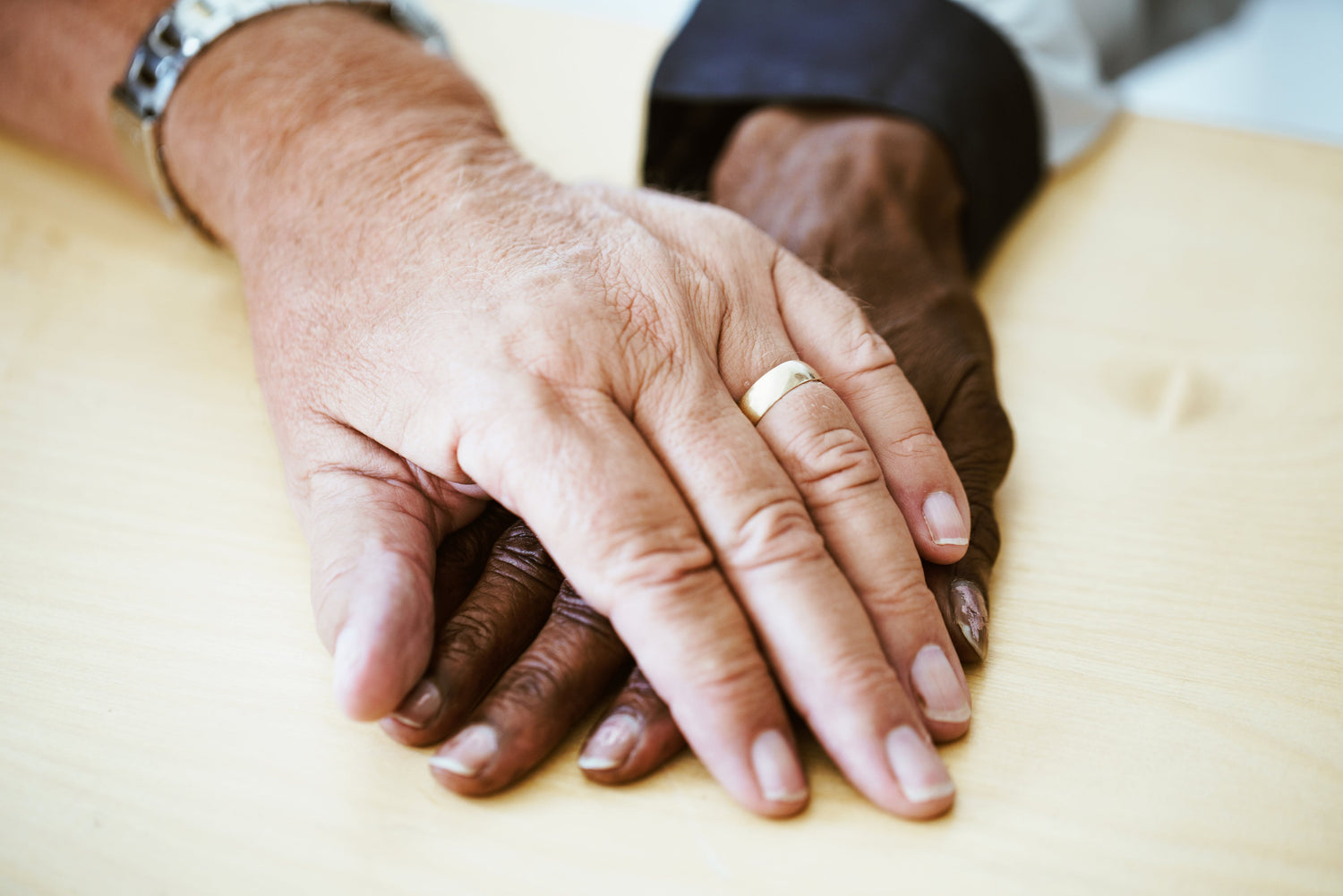 aged couples holding hands